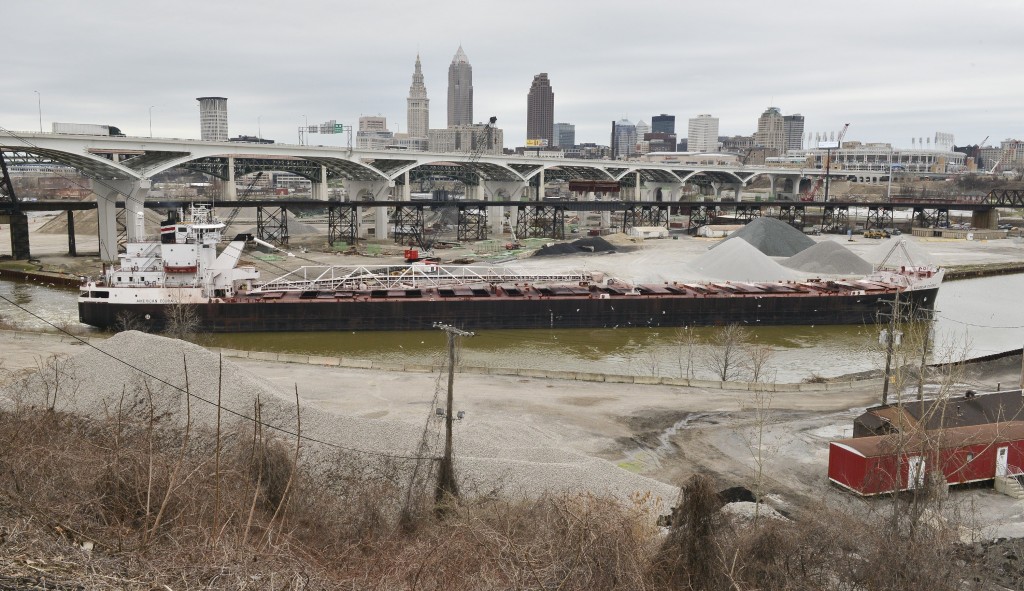 A freighter makes its way up the Cuyahoga River through the heart of Cleveland. John Rennison, Hamilton Spectator 