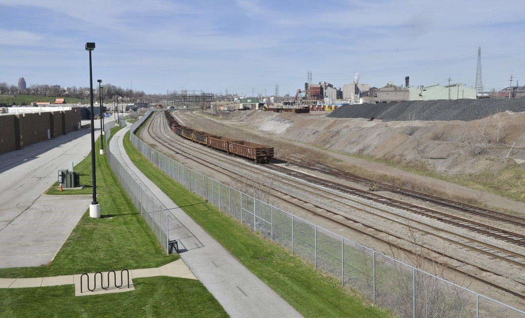  A running/cycling trail runs behind the Steel Yard Commons shopping centre along the railway yard with ArcelorMittal in the distance.  John Rennison The Hamilton Spectator 