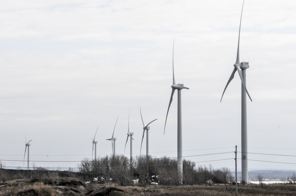 Wind turbines sit on some of the 1,500 acres of former steel land.   John Rennison, Hamilton Spectator 